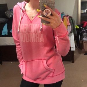 Pink Under Armor hoodie.